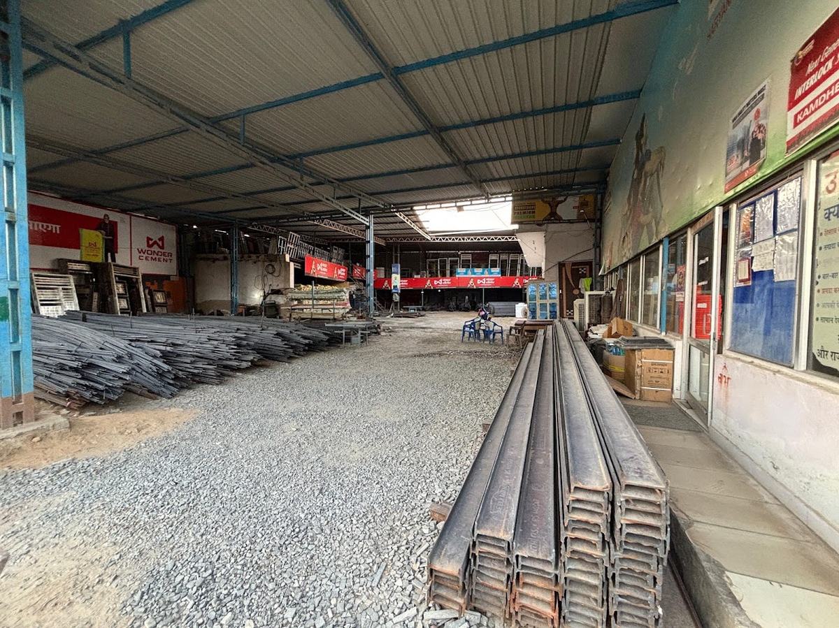 Covered yard with steel girders and TMT stacks